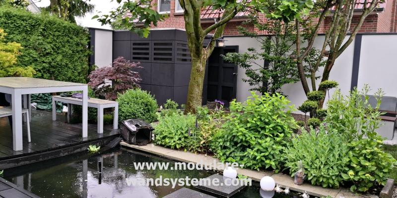 Sichtschutz--Lärmschutzwand-mit-Gartenhaus-HPL-Platten